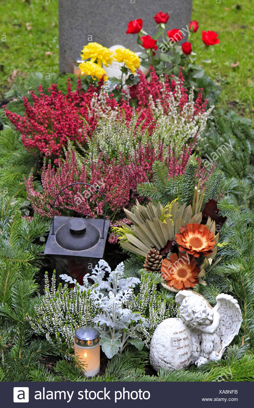 Geschmuecktes Grab auf einem Friedhof an Allerheiligen Stock Photo