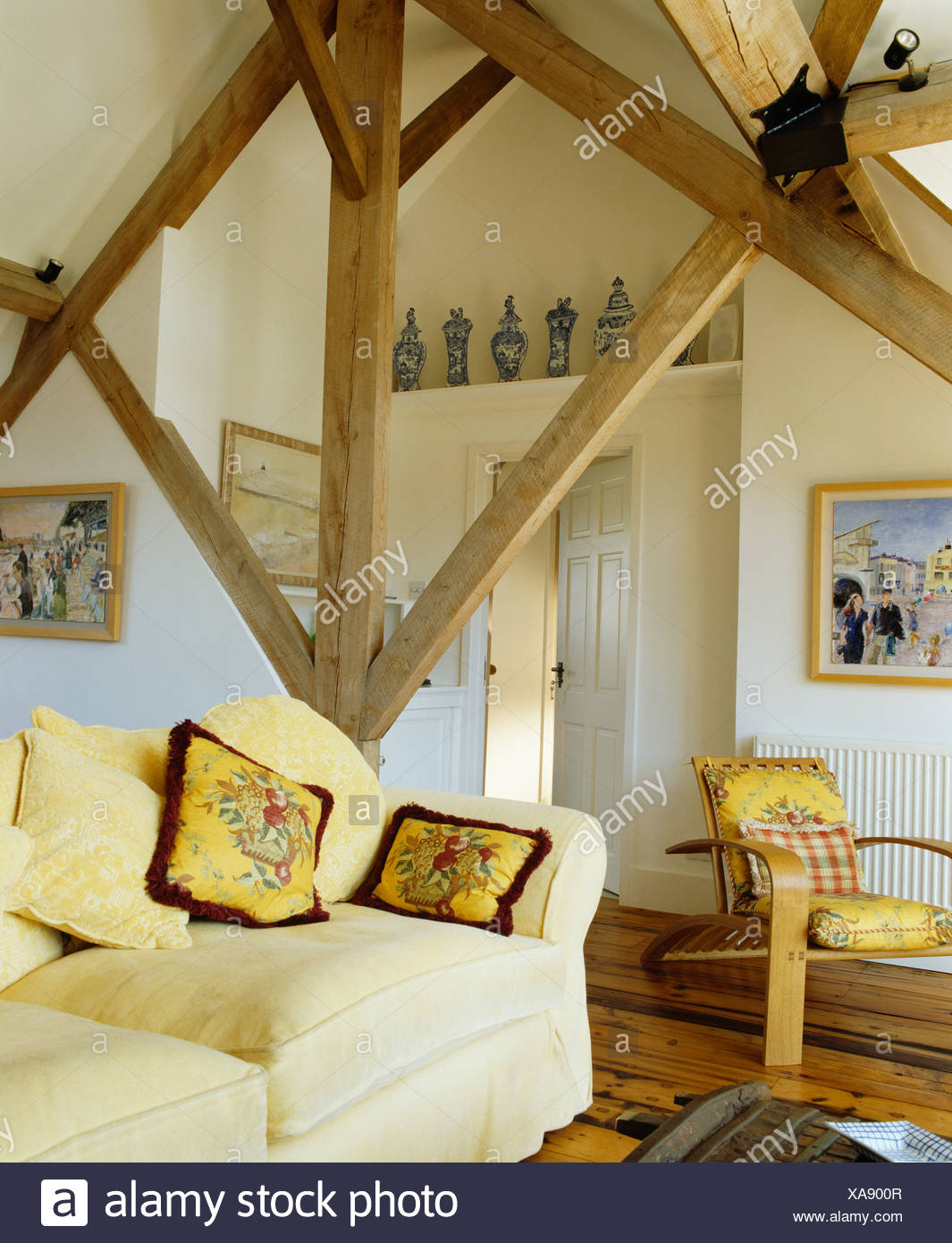 Rustic Wooden Beams And Apex Ceiling In Country Living Room