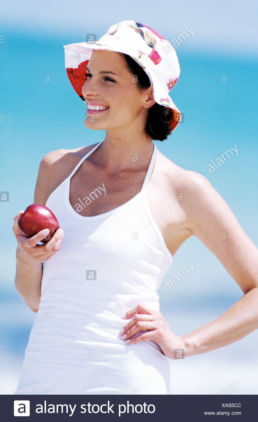 Female Short Brunette Hair Wearing White Dress And White And Pink