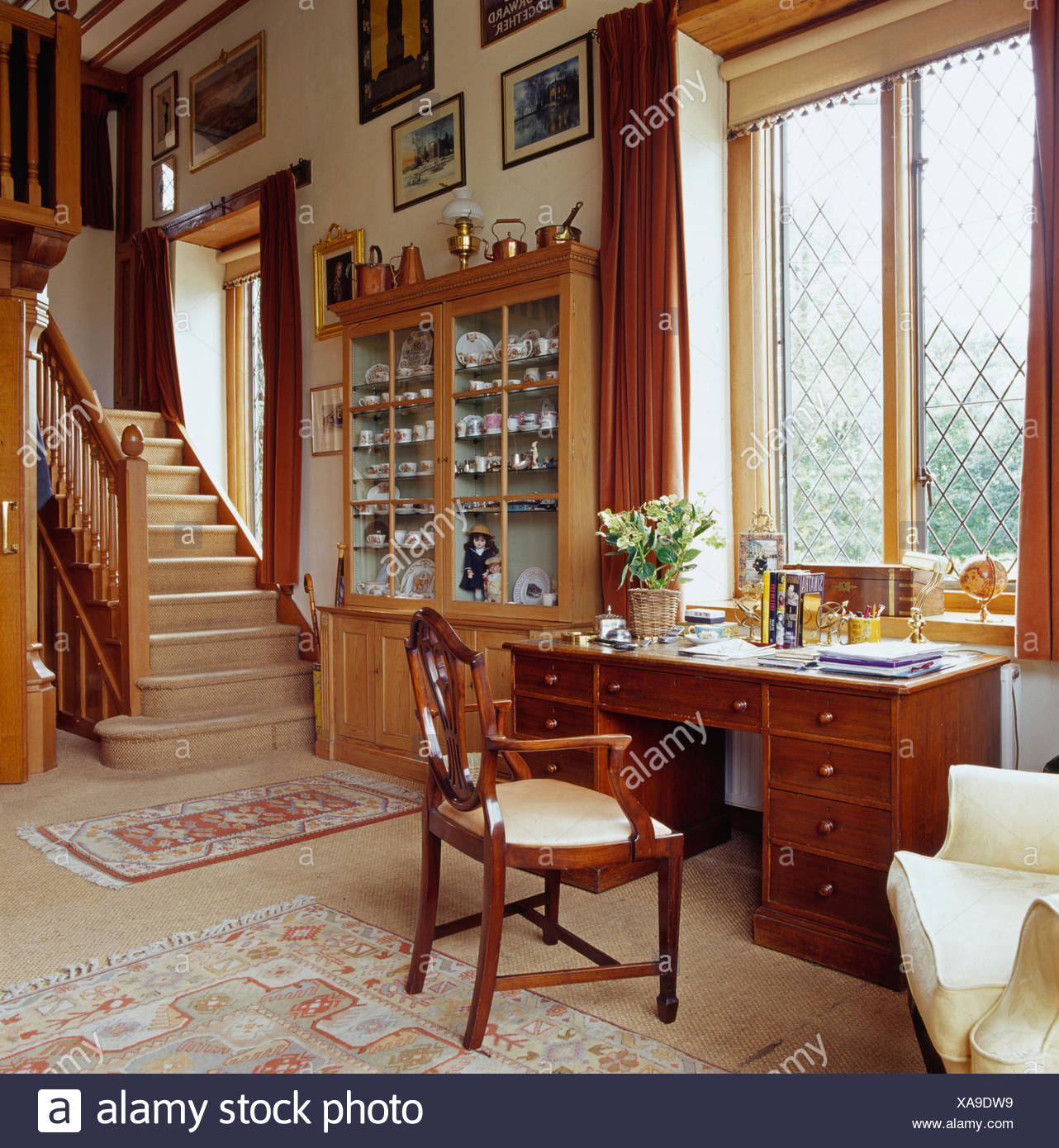 Antique Desk And Chair In Front Of Window In Large Country Hall