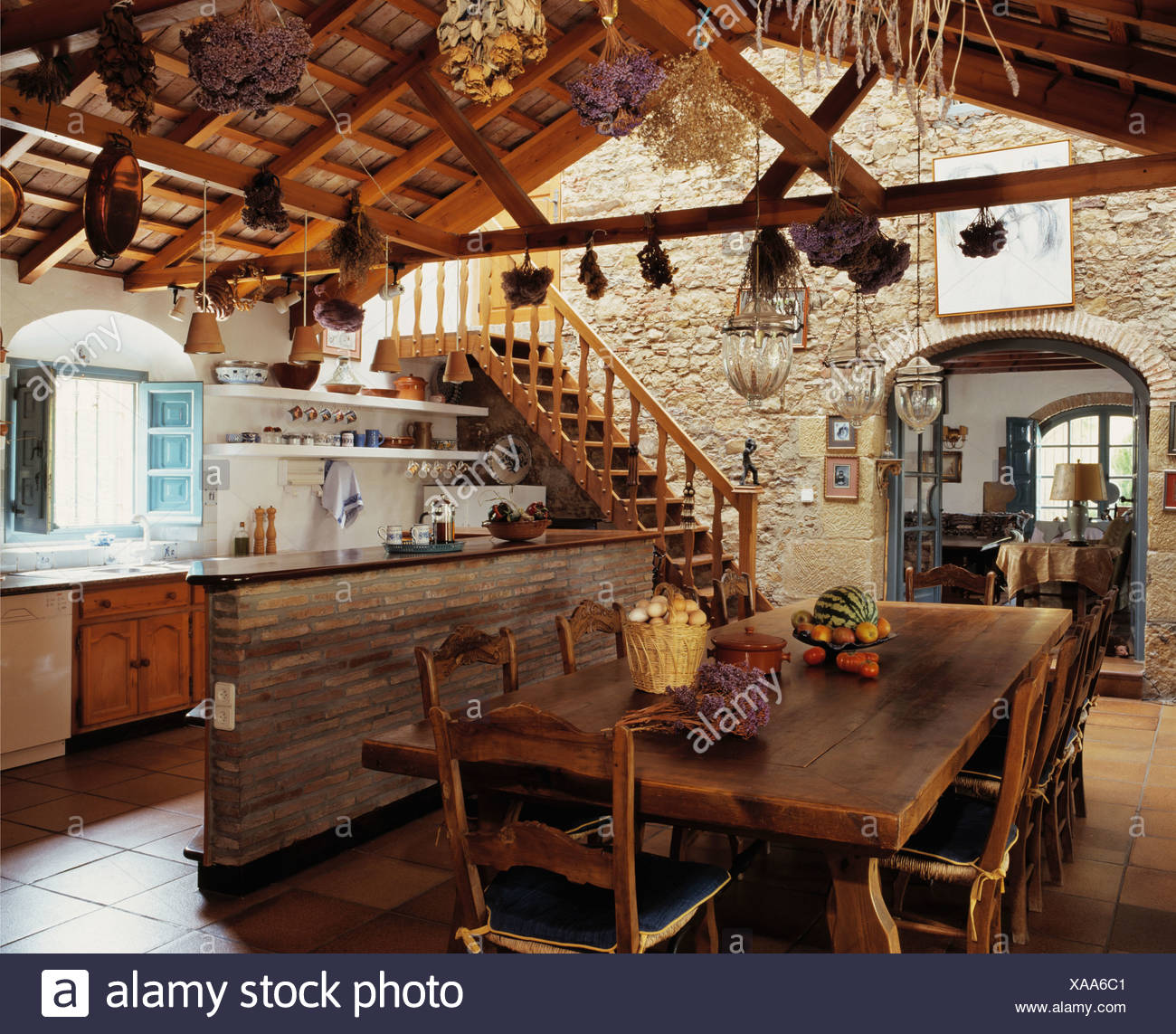 Rustic Wooden Table And Chairs In Dining Area Of Large