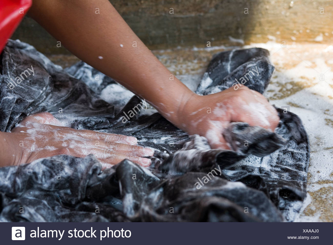 Hand Washing Clothes Stock Photos & Hand Washing Clothes Stock Images