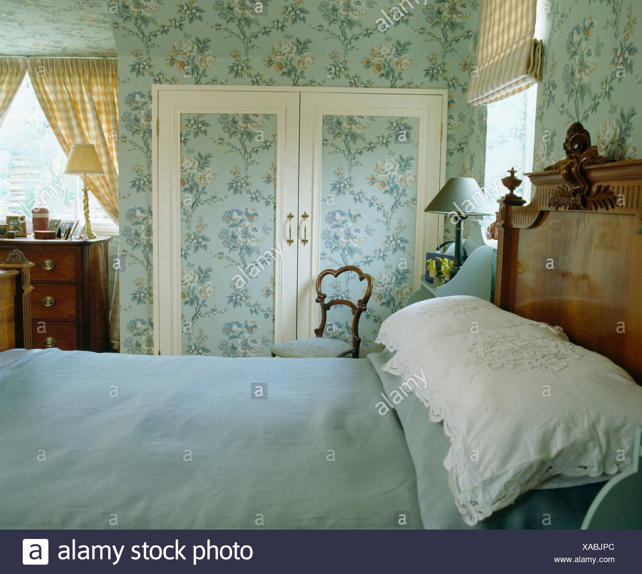 Blue Bed Cover And White Pillows On Bed In Country Bedroom With