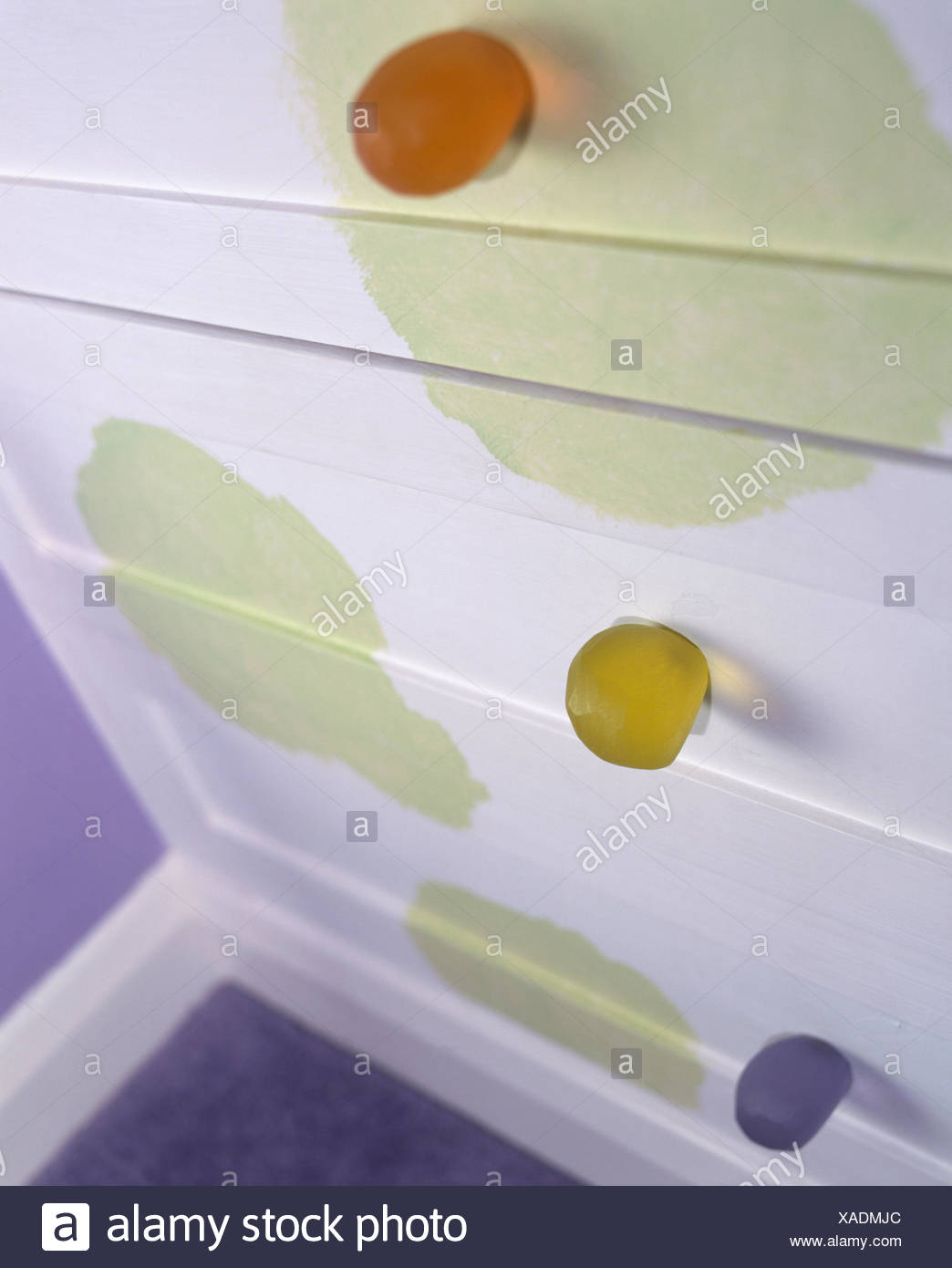 Close Up Of White Drawers With Green Hand Painted Pattern And