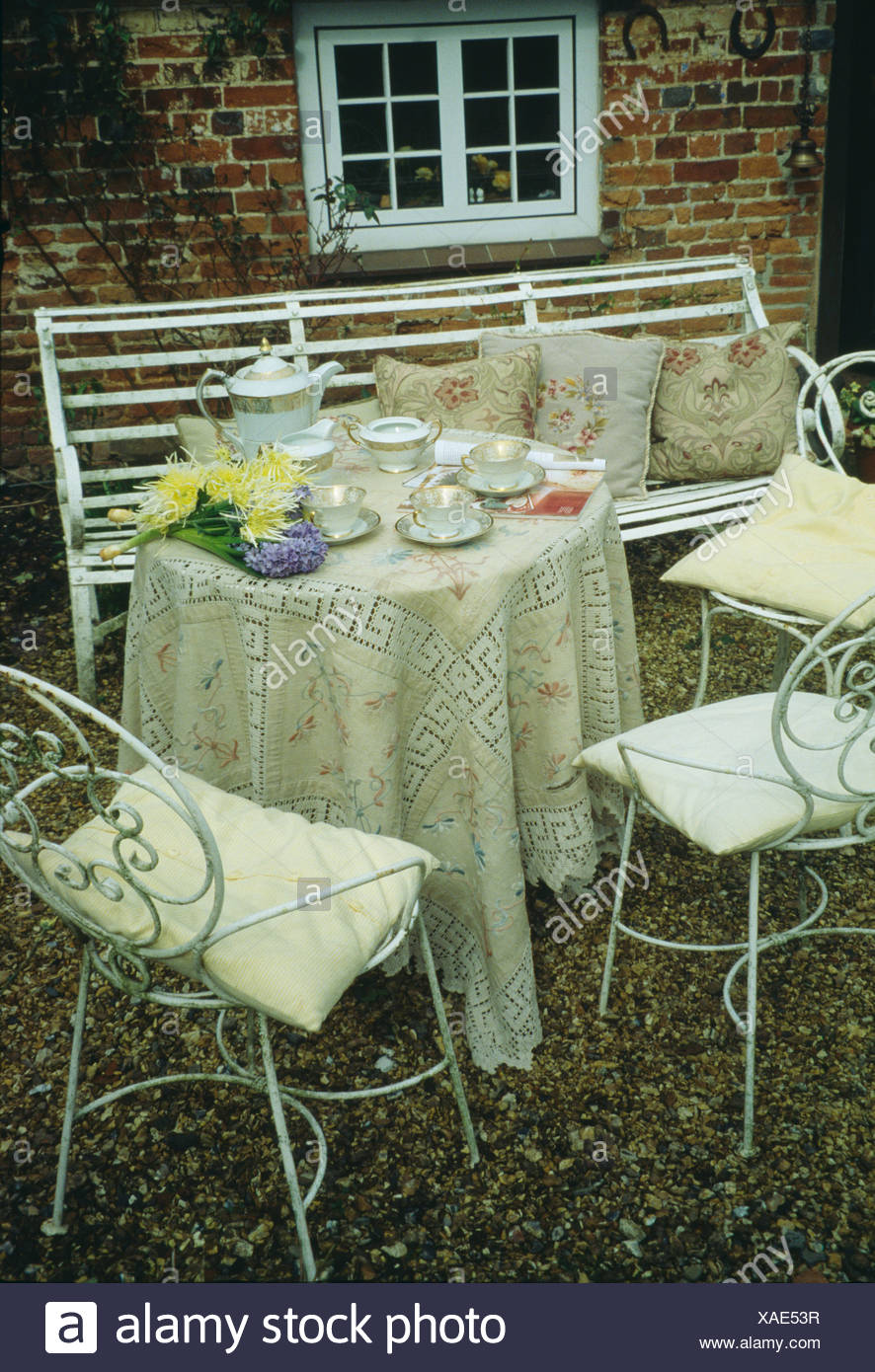 Fabulous Wrought Iron Benches With Striped Cushion Plus White And