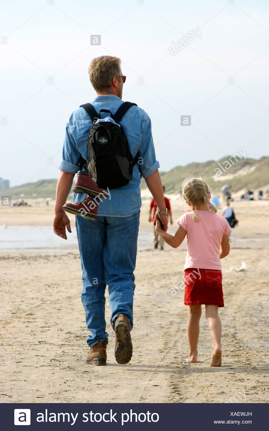 Parent And Child Holding Hands Walking Away Backpack Stock Photo Alamy