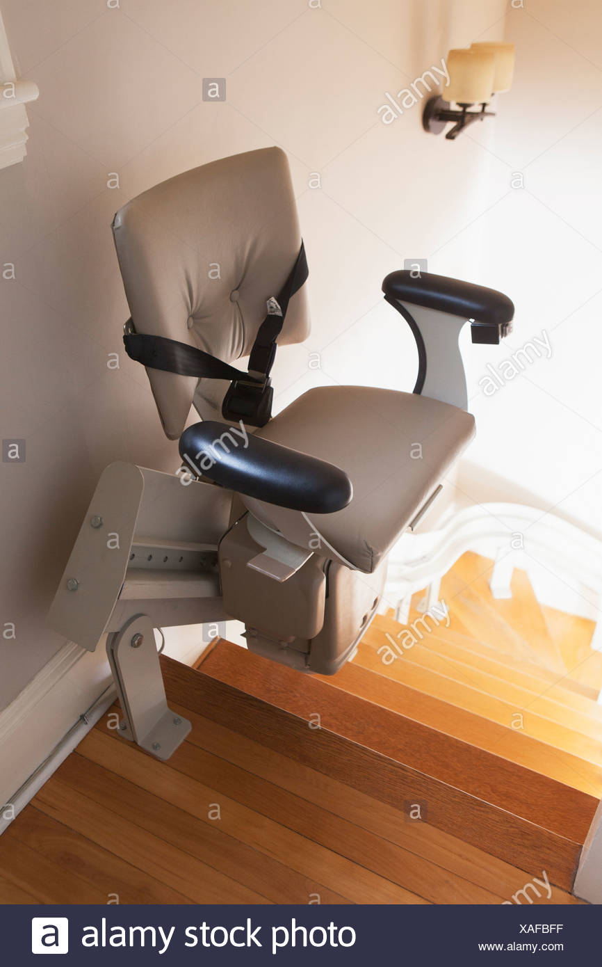 Motorized Stair Lift Chair At Top Of Stairs Stock Photo Alamy