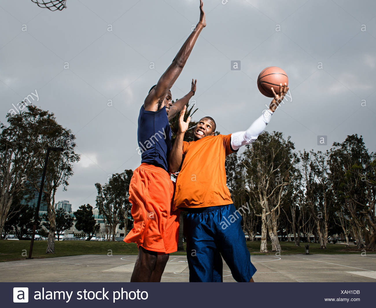 Young Man Playing Basketball On Court Stock Photos & Young Man Playing