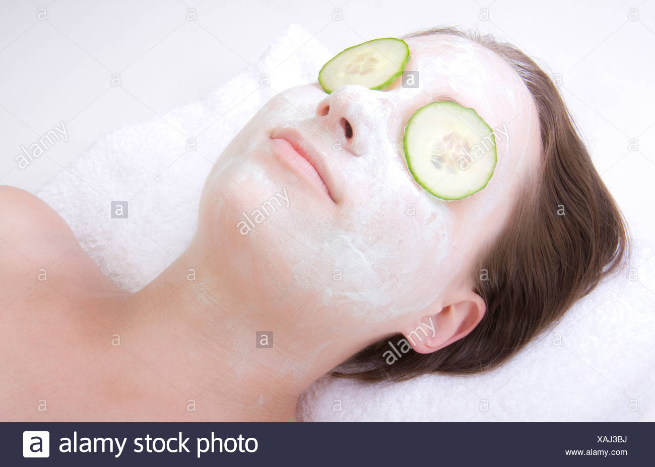 Download Young Woman With Cucumber Face Mask Stock Photo Alamy PSD Mockup Templates