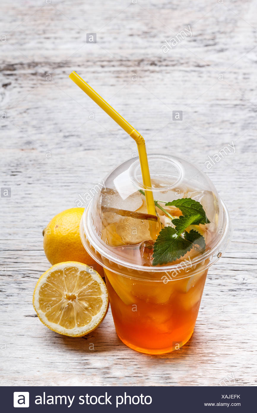 Iced Tea In Plastic Cup With Lemon And Mint Stock Photo Alamy
