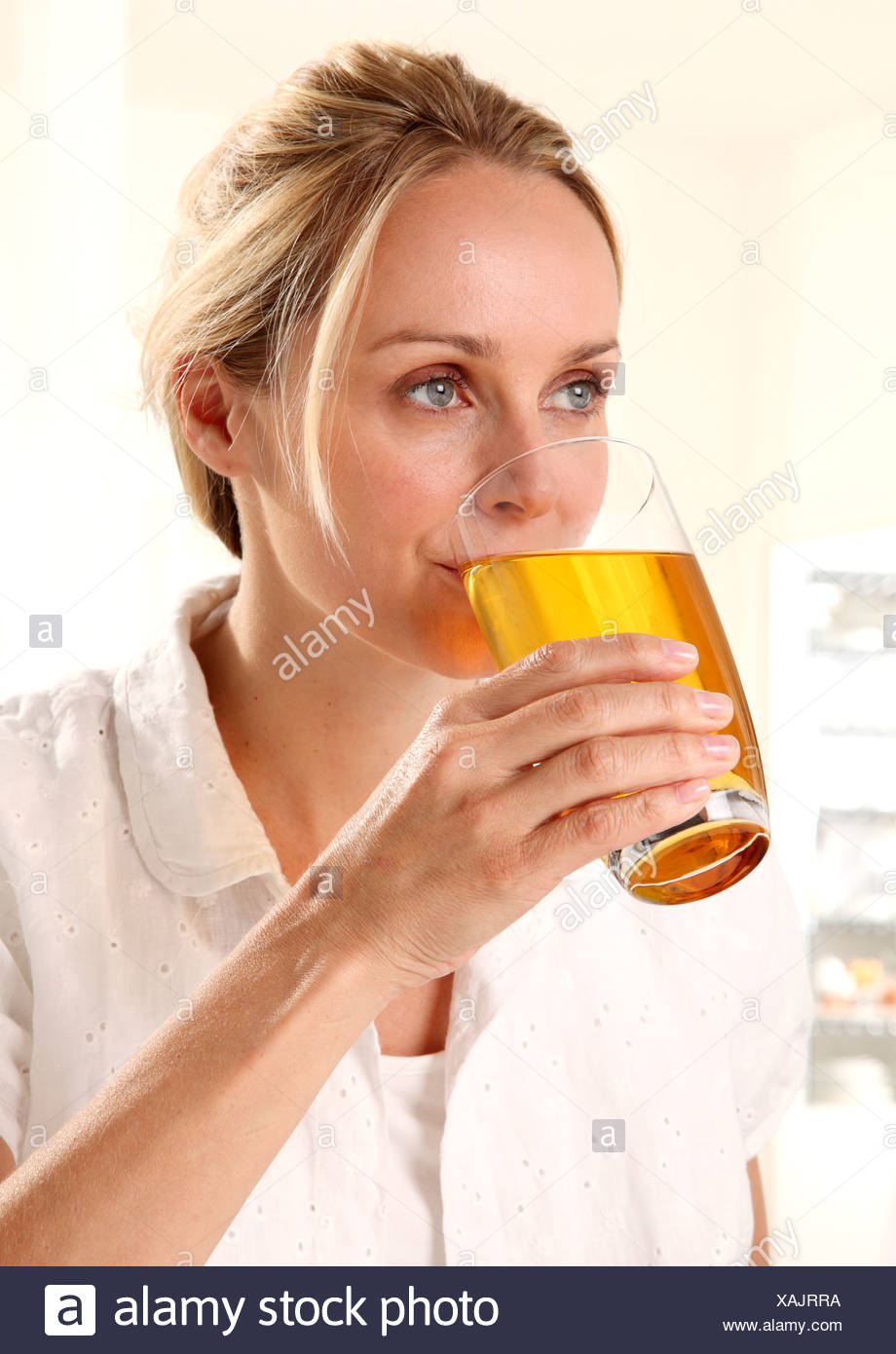 WOMAN DRINKING APPLE JUICE Stock Photo: 281926270 - Alamy
