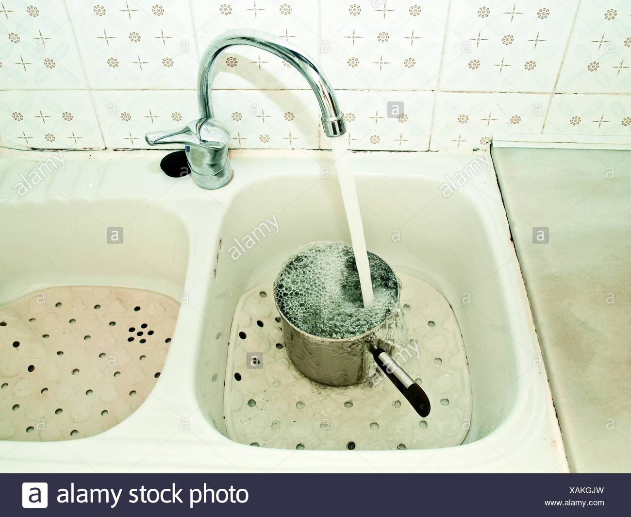 Kitchen Sink Water Overflowing From A Pot Stock Photo