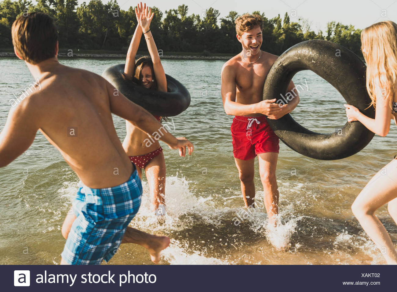 Man Floating In An Inner Tube High Resolution Stock Photography and