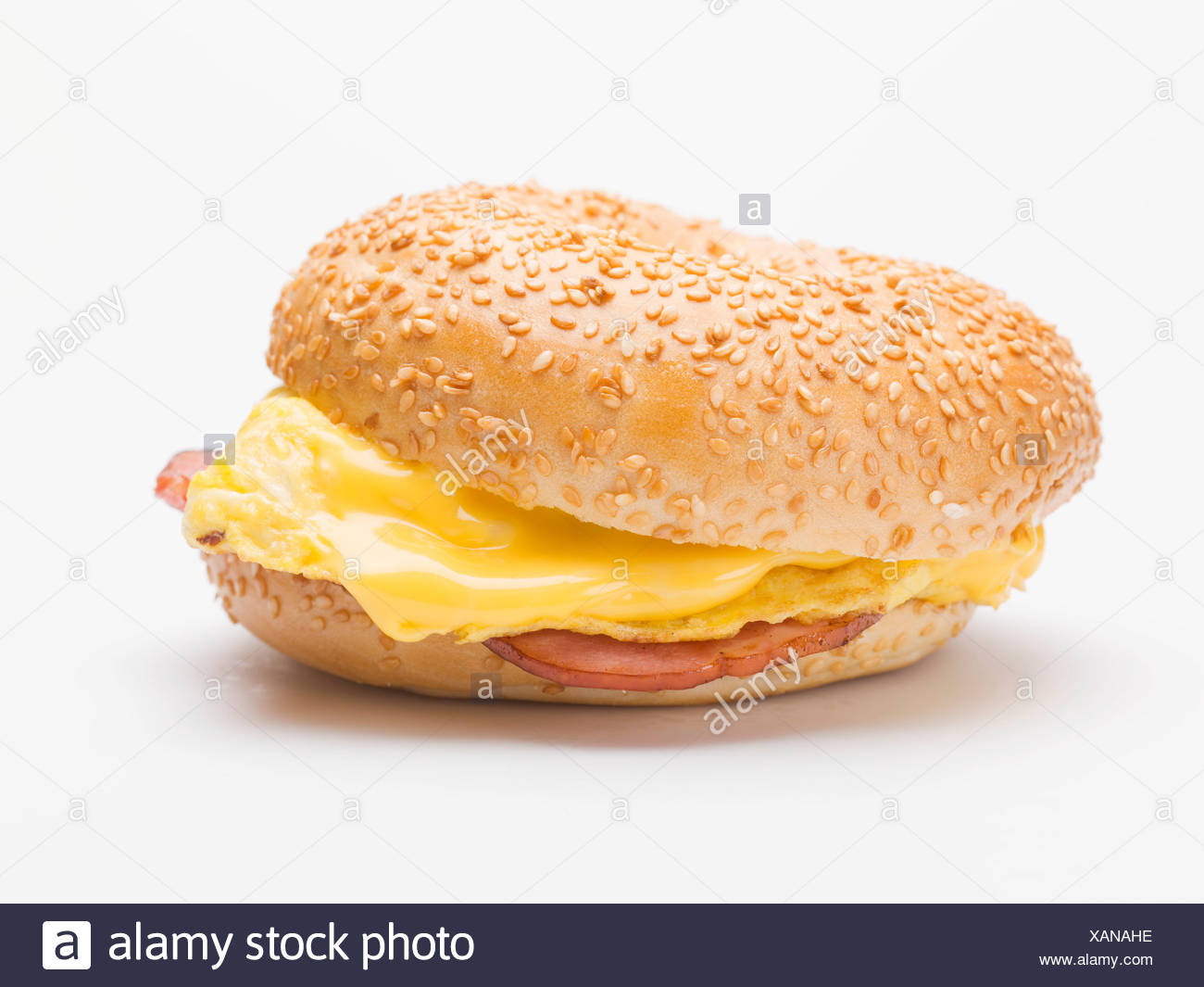 Sesame Bagel Filled With Scrambled Egg Cheese And Ham Stock Photo Alamy