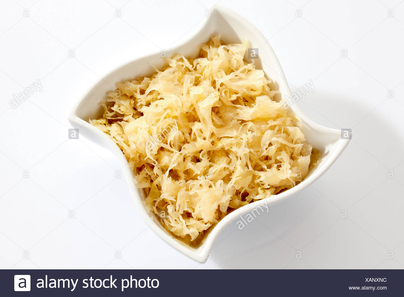 Sauerkraut from a can in a white porcelain bowl Stock Photo