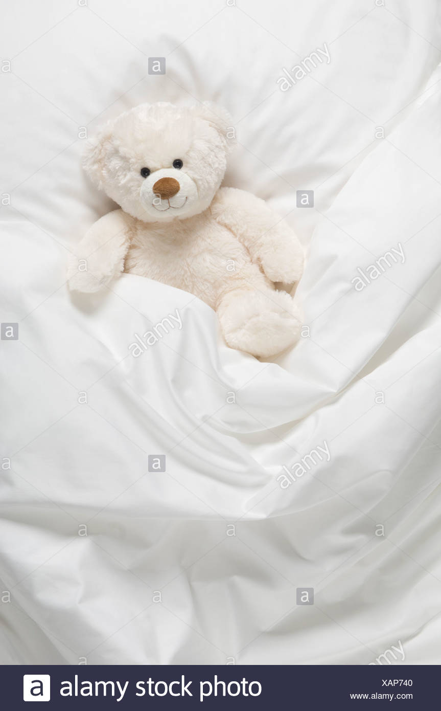 teddy bear on bed