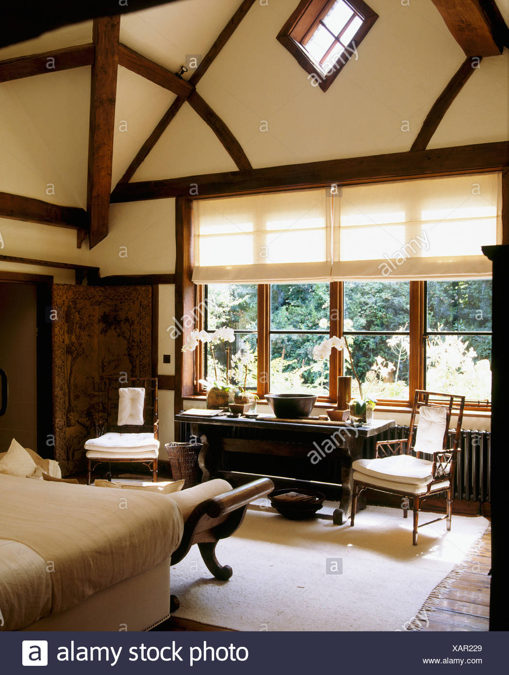 Tudor Style Beams And High Vaulted Ceiling In Country Bedroom With