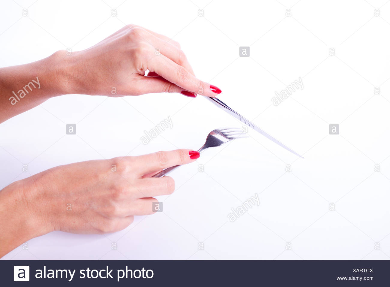 Woman Holding Knife And Fork High Resolution Stock Photography and
