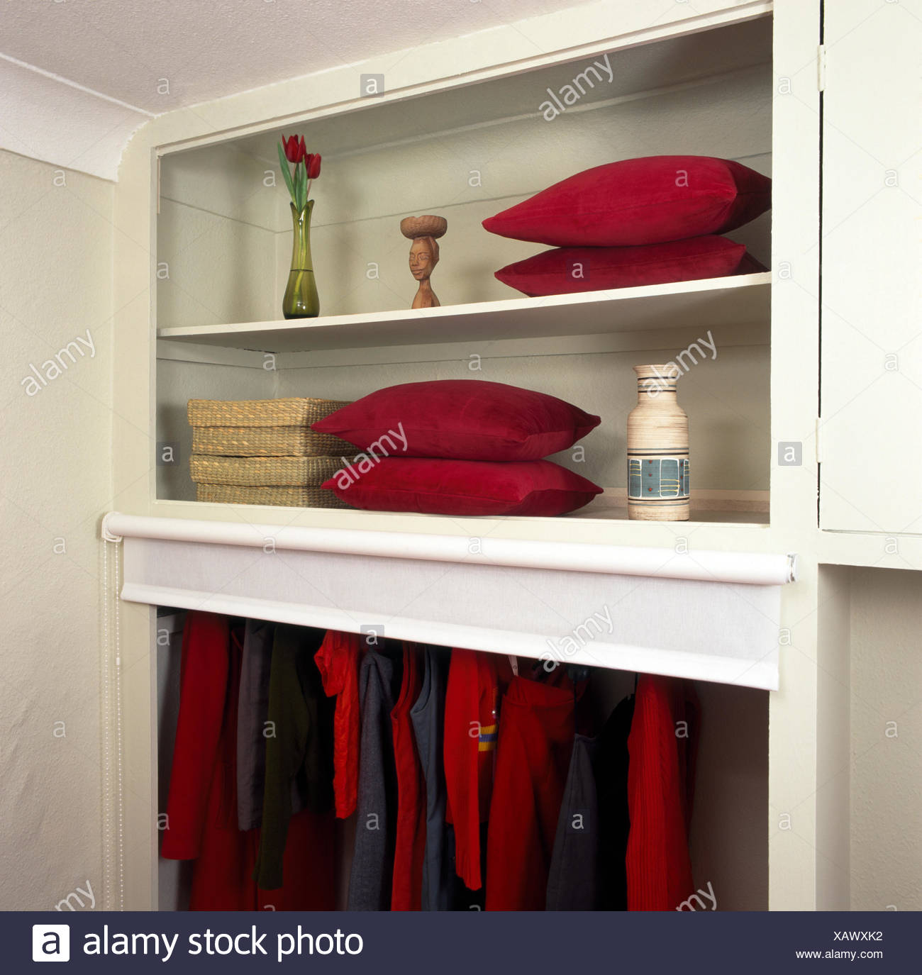 Open Shelves Above Clothes Storage With Blind Raised In