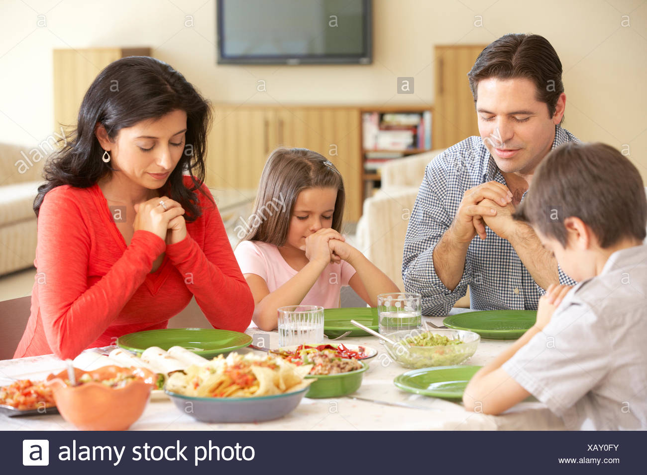 Family Praying Together Meal Dining Stock Photos & Family Praying