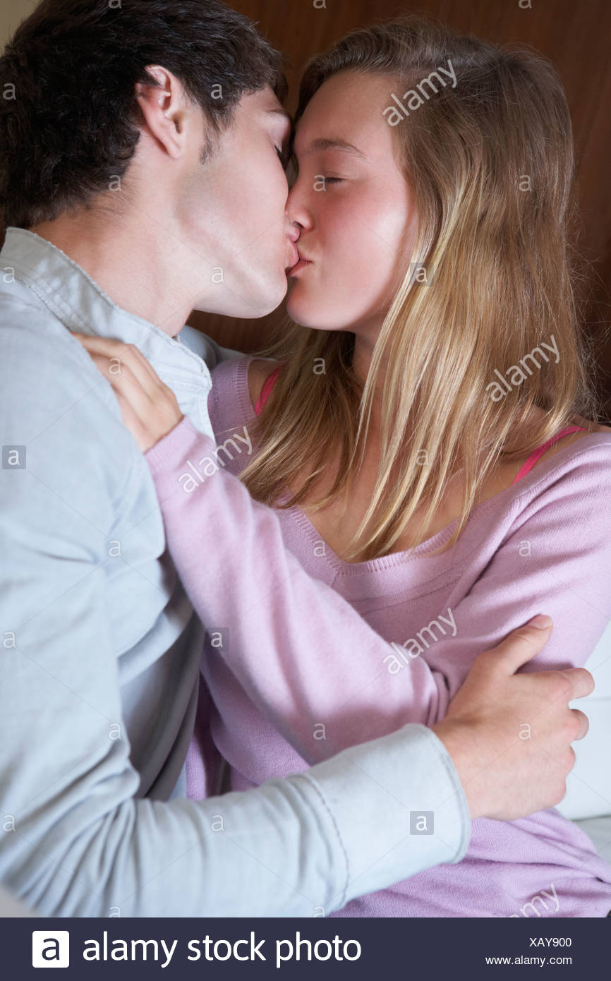 Loving Kissing On Sofa Stock Photos Loving Kissing On Sofa Stock