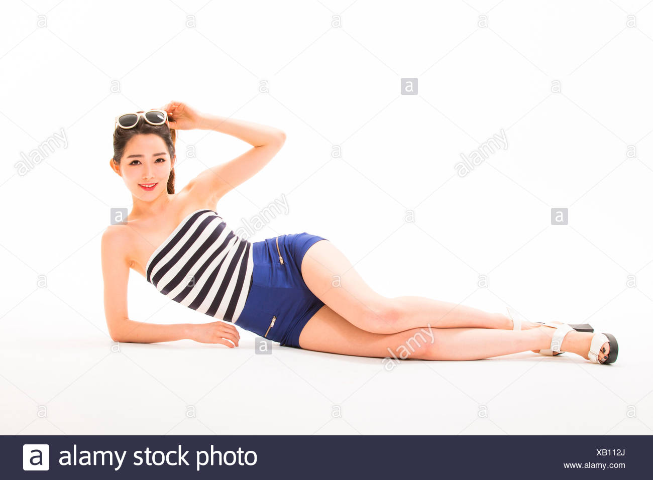 picture Laying Down Poses Photography https www alamy com young smiling slim woman posing lying down on her side image282149914 html
