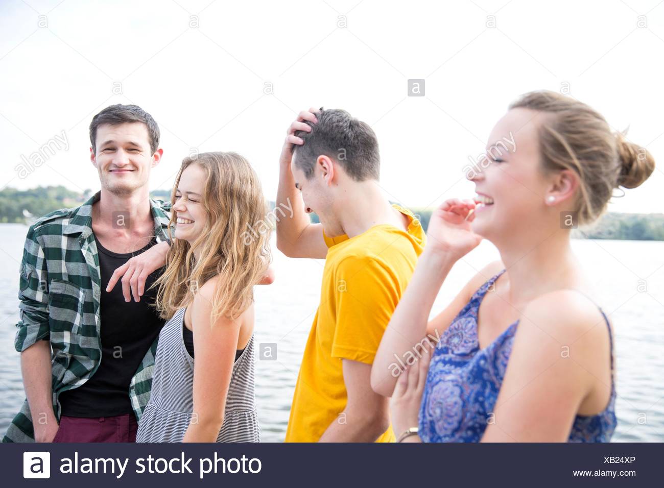 Group of young adults, outdoors, laughing Stock Photo