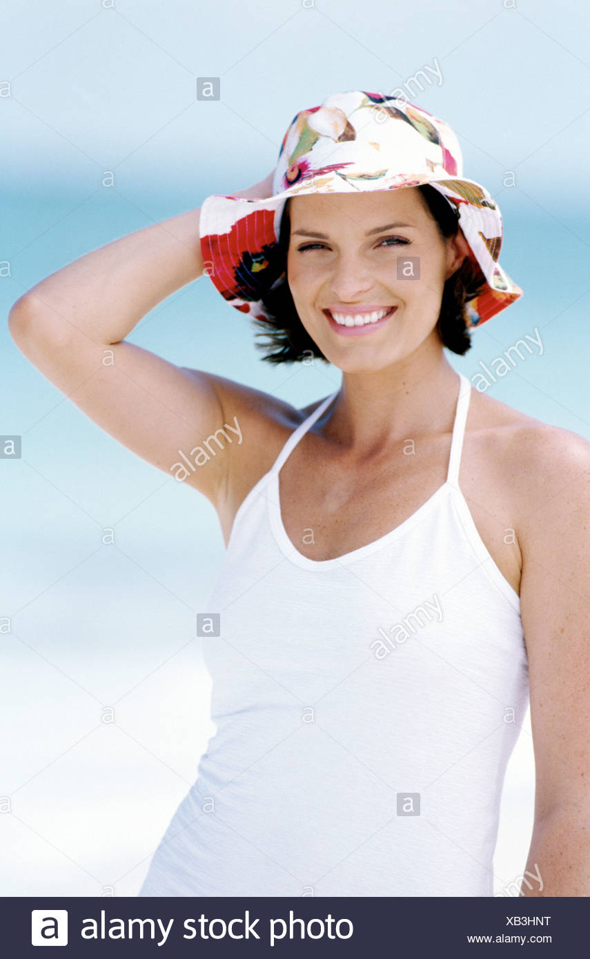 Female Short Brunette Hair Wearing White Dress And White And Pink