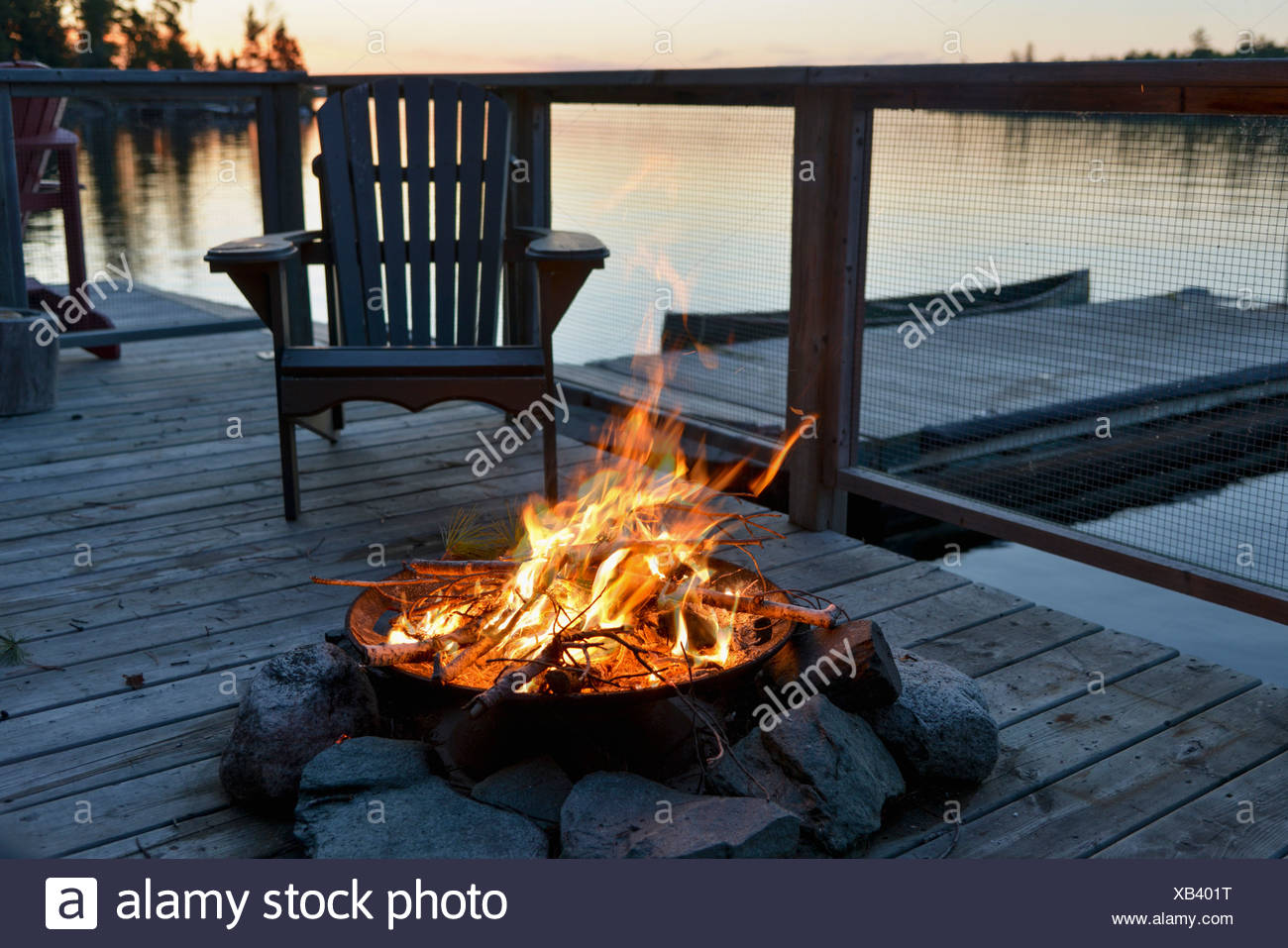 Fire Pit On A Wooden Dock On A Lake At Sunset Lake Of The Woods