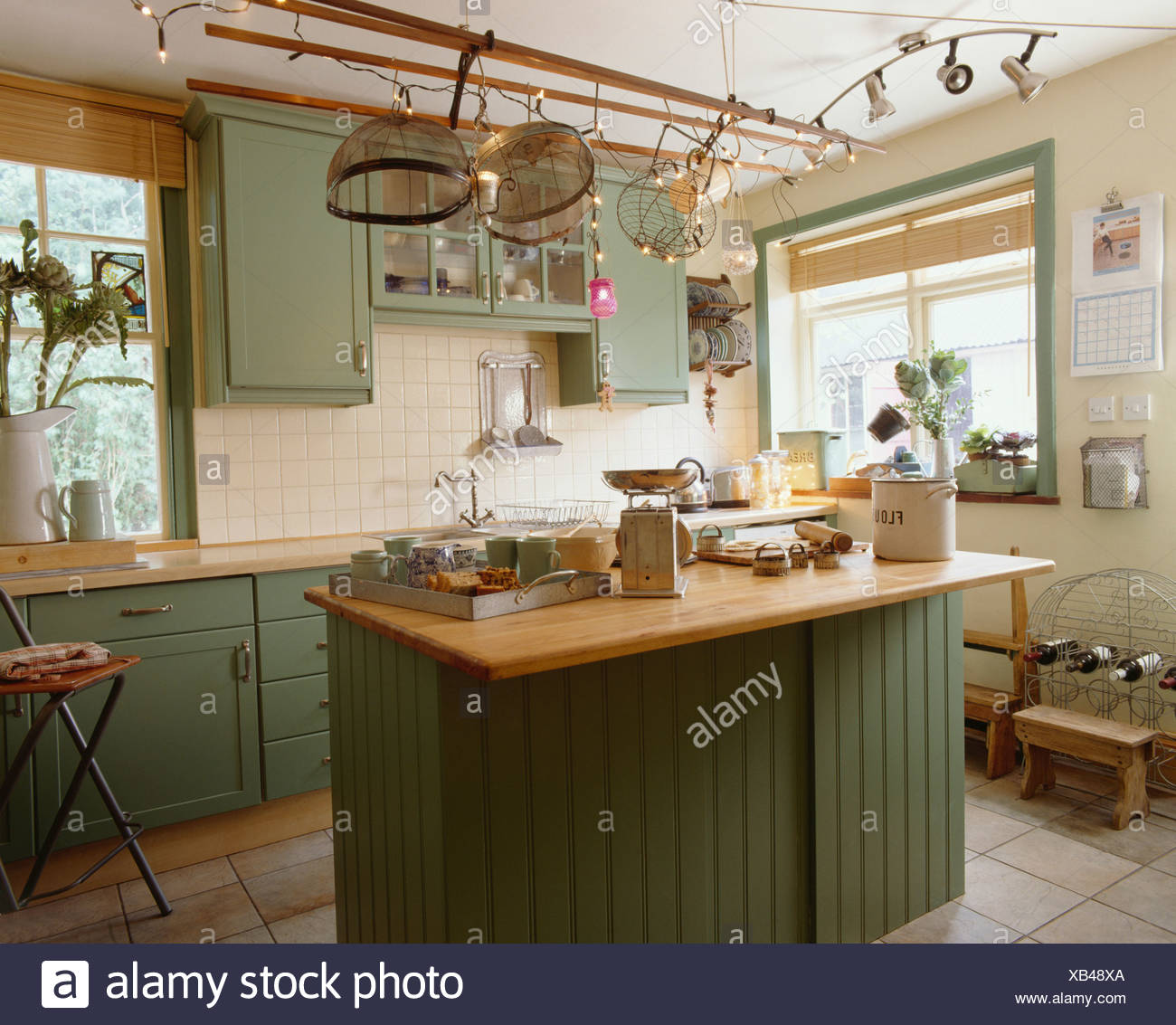 Novelty Lighting And Metal Mesh Food Covers On Ceiling Rack Above