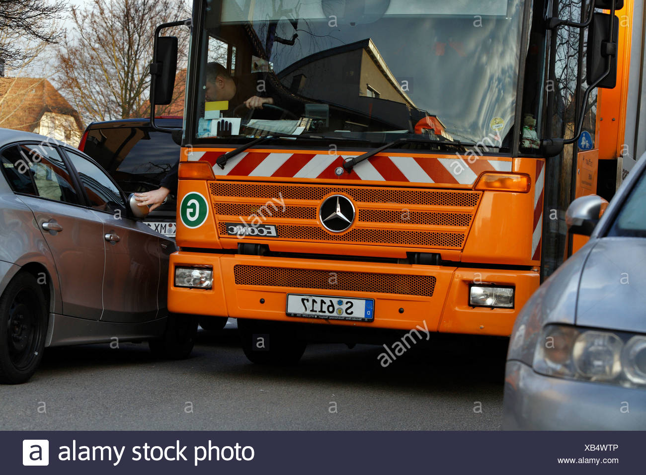 Driver Of A Garbage Truck For The Stuttgart Garbage Company Called Aws Or Abfallwirtschaft Stuttgart Is Forced To Fold Back A Stock Photo Alamy