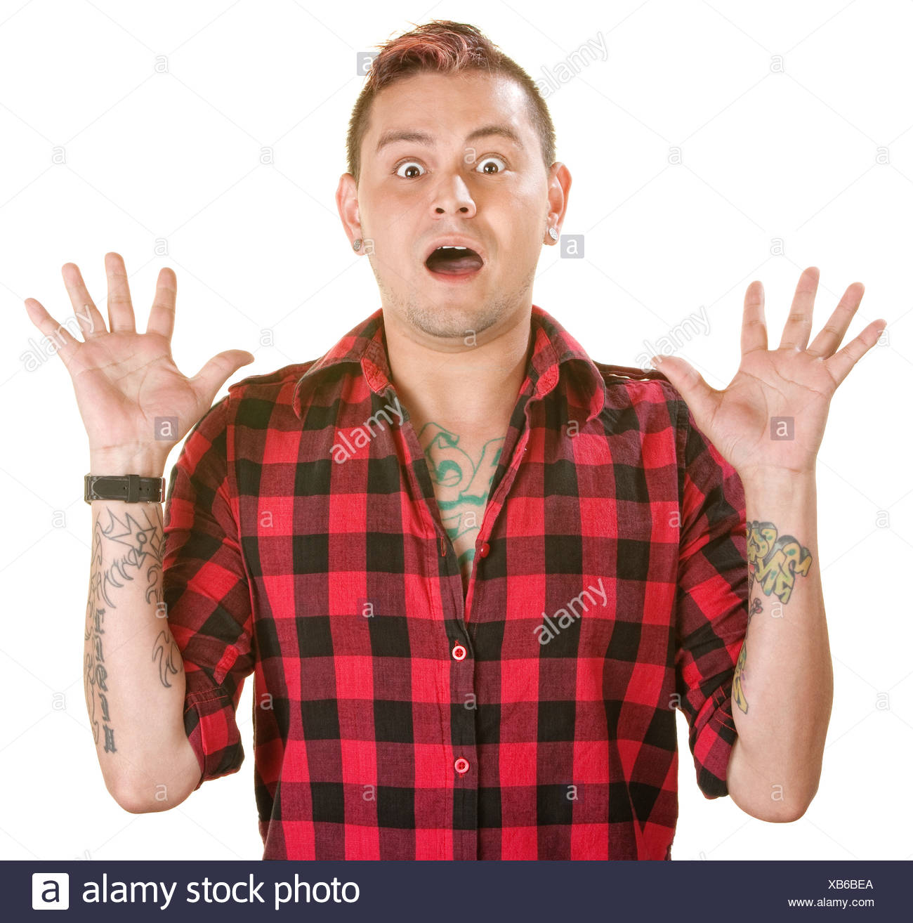 Scared Hispanic Man With Spiky Dyed Hair Over White Stock Photo