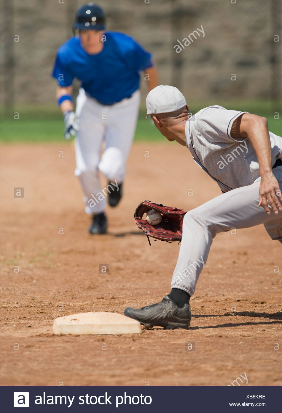 Baseball player trying to steal base Stock Photo - Alamy