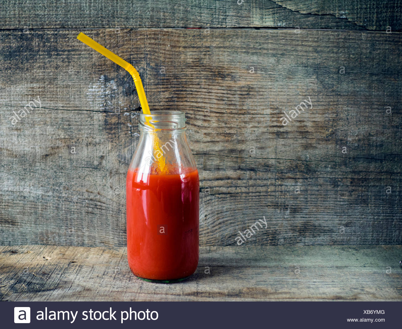 Download Tomato Juice In Glass Bottle With Straw Stock Photo Alamy