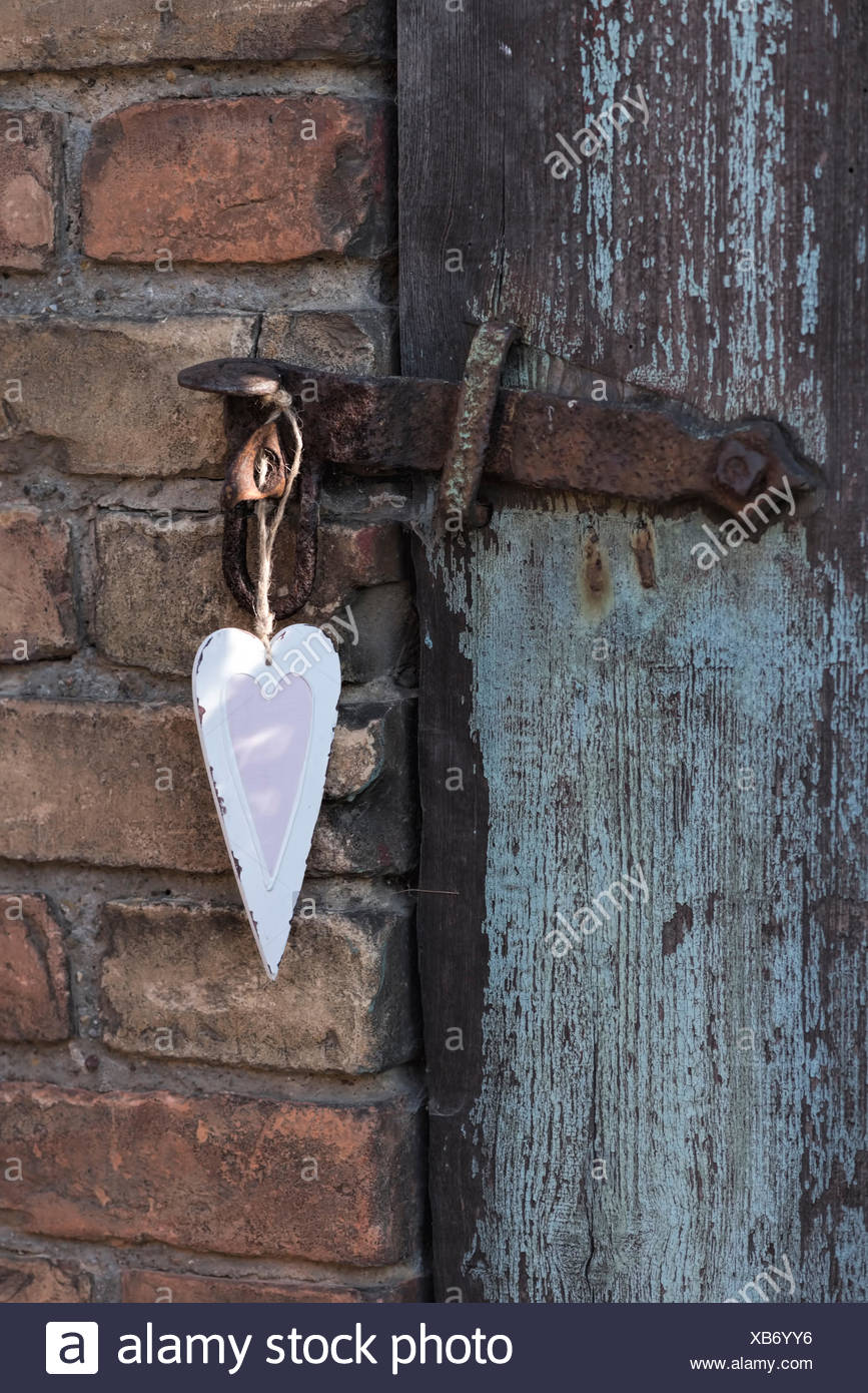 Gentle Heart For Decoration In Pink And White Hanging On An Old