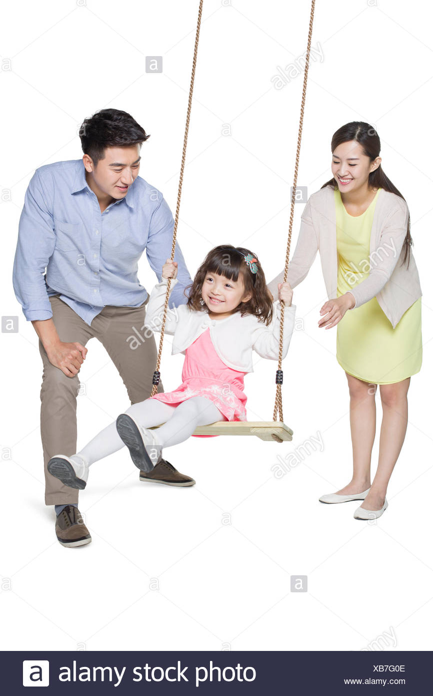 Young Parents Pushing Daughter On Swing Stock Photo Alamy Young Parents Pushing Daughter On Swing Stock Photo Alamy