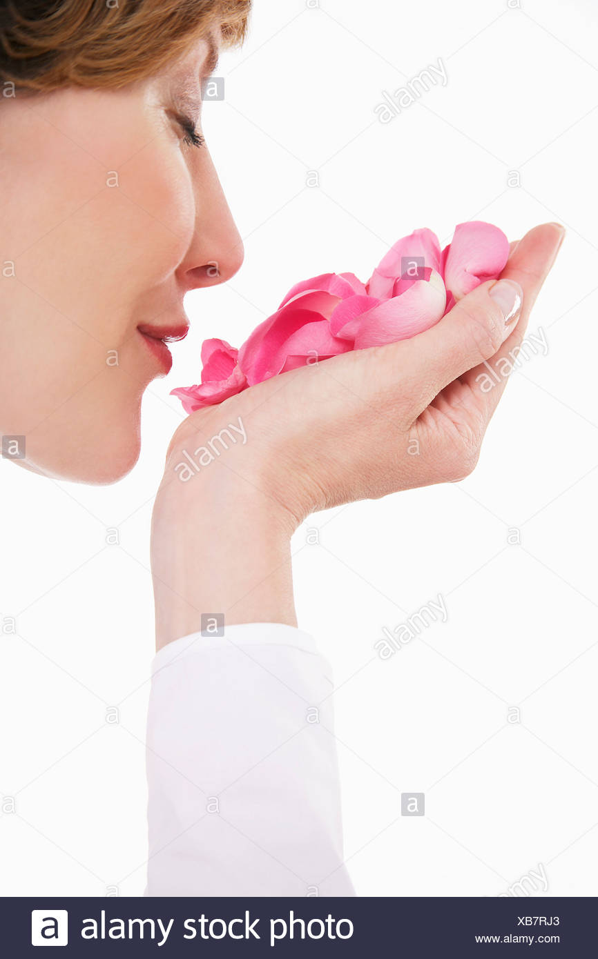 Woman Smelling Rose Petals High Resolution Stock Photography and Images