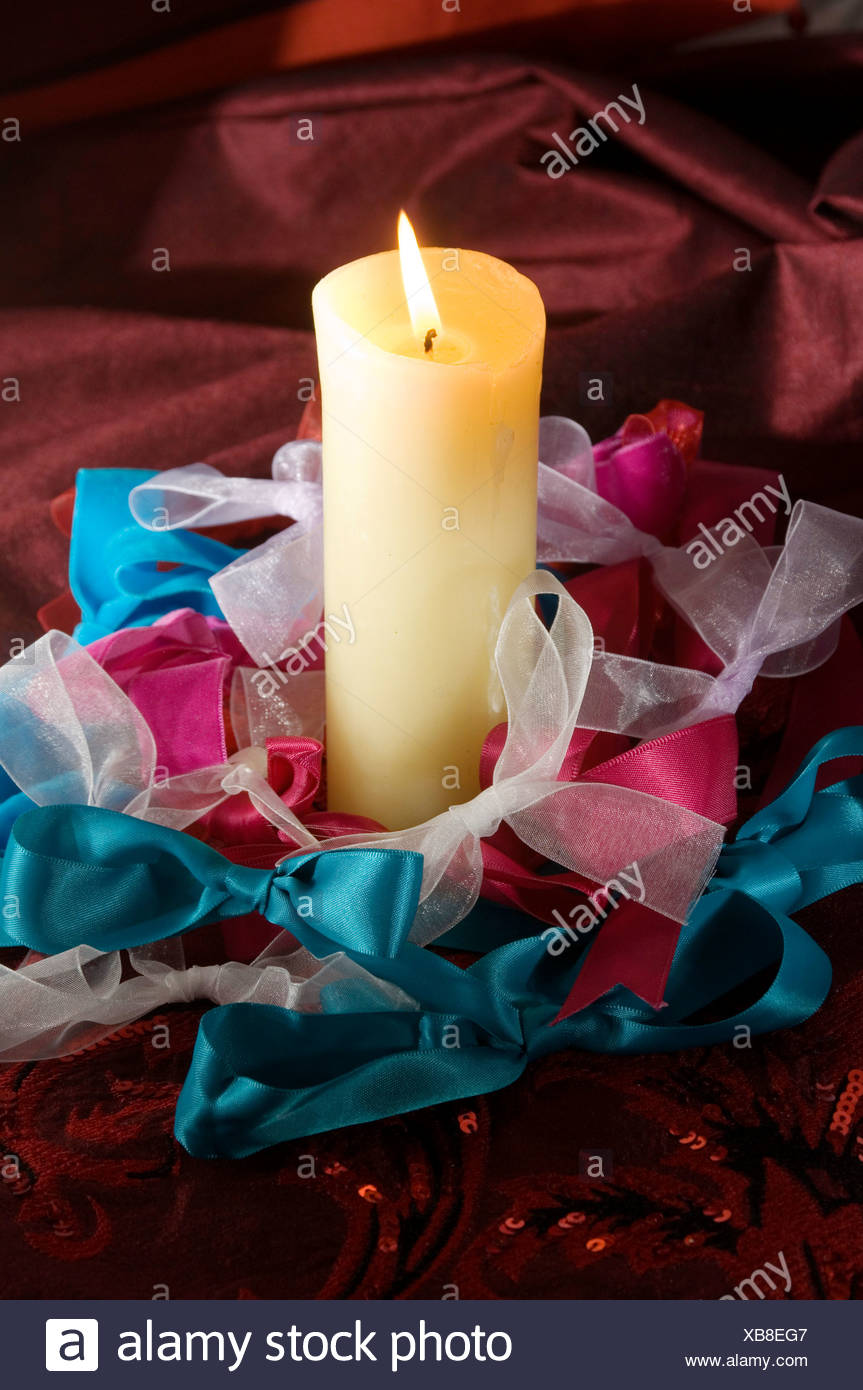 A Still Life Of A Christmas Table Decoration A Cream Pillar