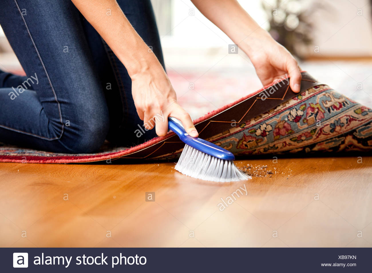 Sweeping Under Carpet High Resolution Stock Photography and Images Alamy