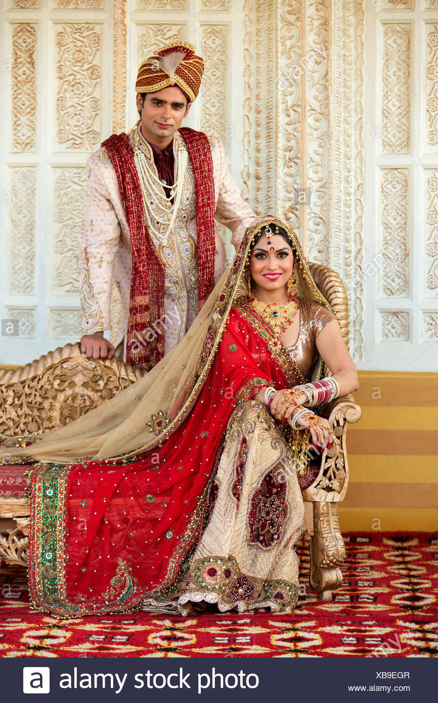 Indian Bride And Groom In Traditional Wedding Dress Stock Photo