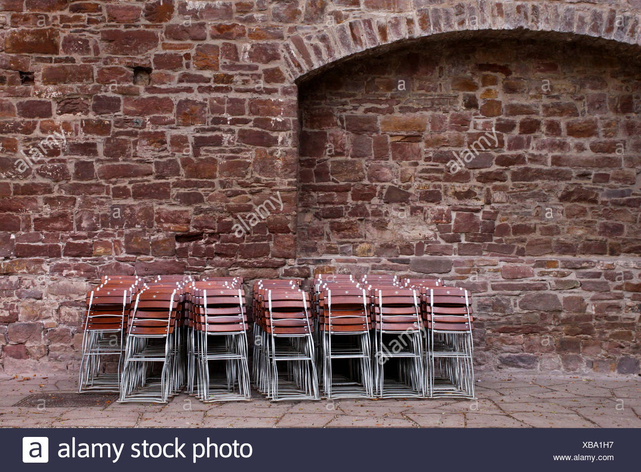 brown brownish brunette chairs space saving folded up chair furniture brown Stock Photo