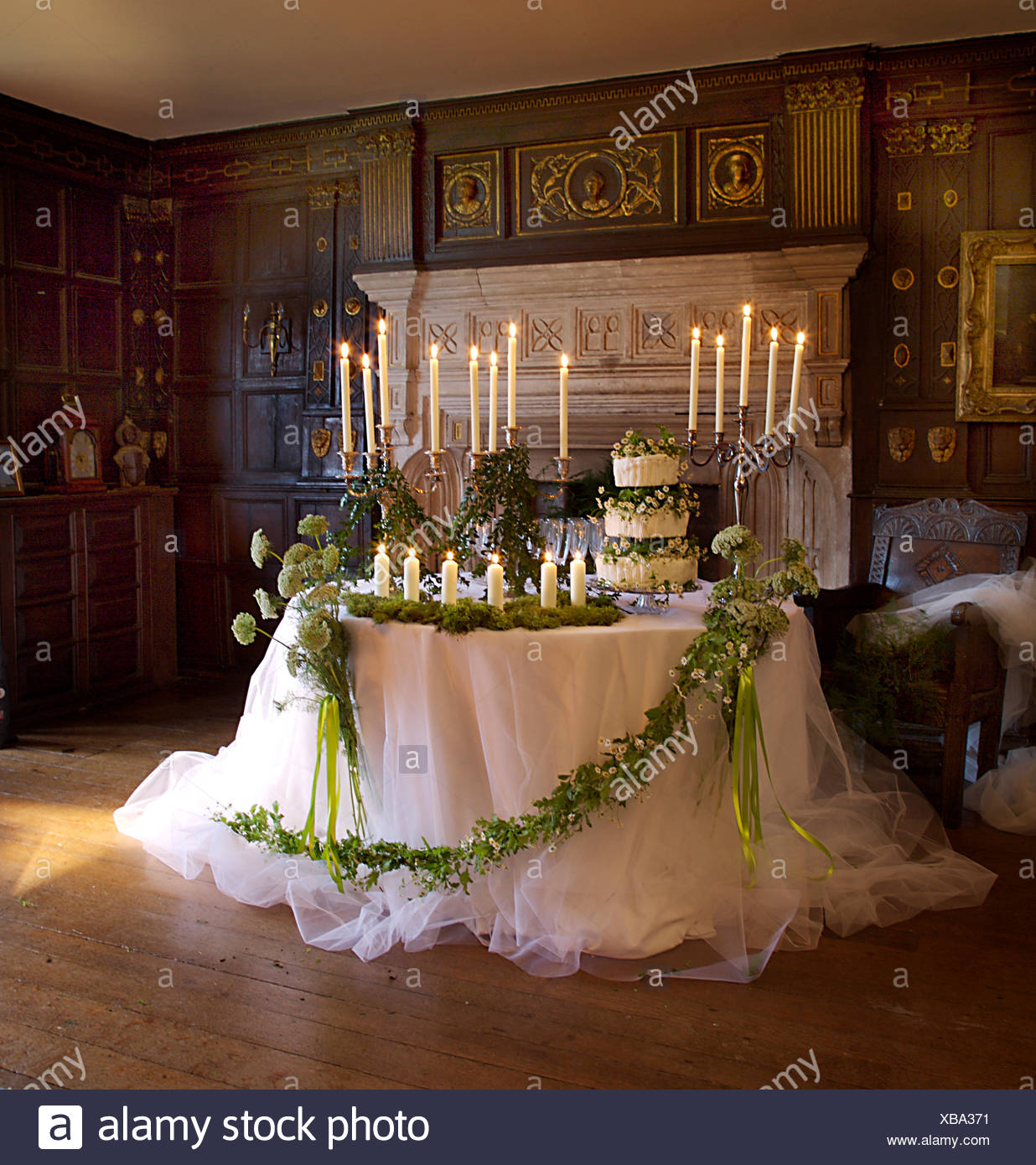 White Net Cloth With Foliage And Wild Flower Garland On Table Set