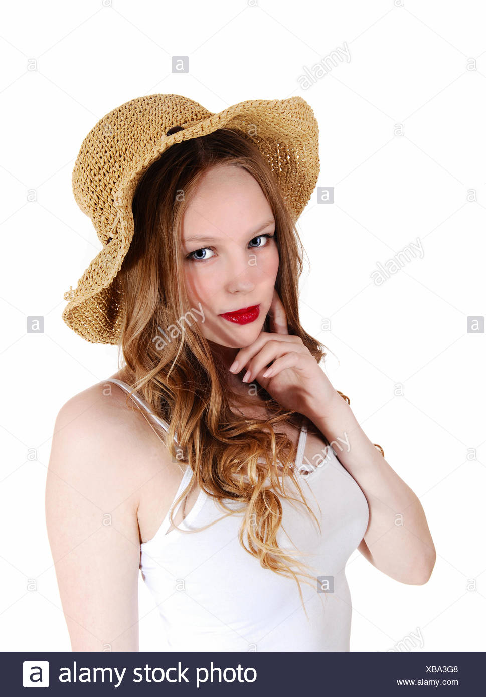 A Lovely Young Woman With Long Curly Blond Hair Wearing A Beige
