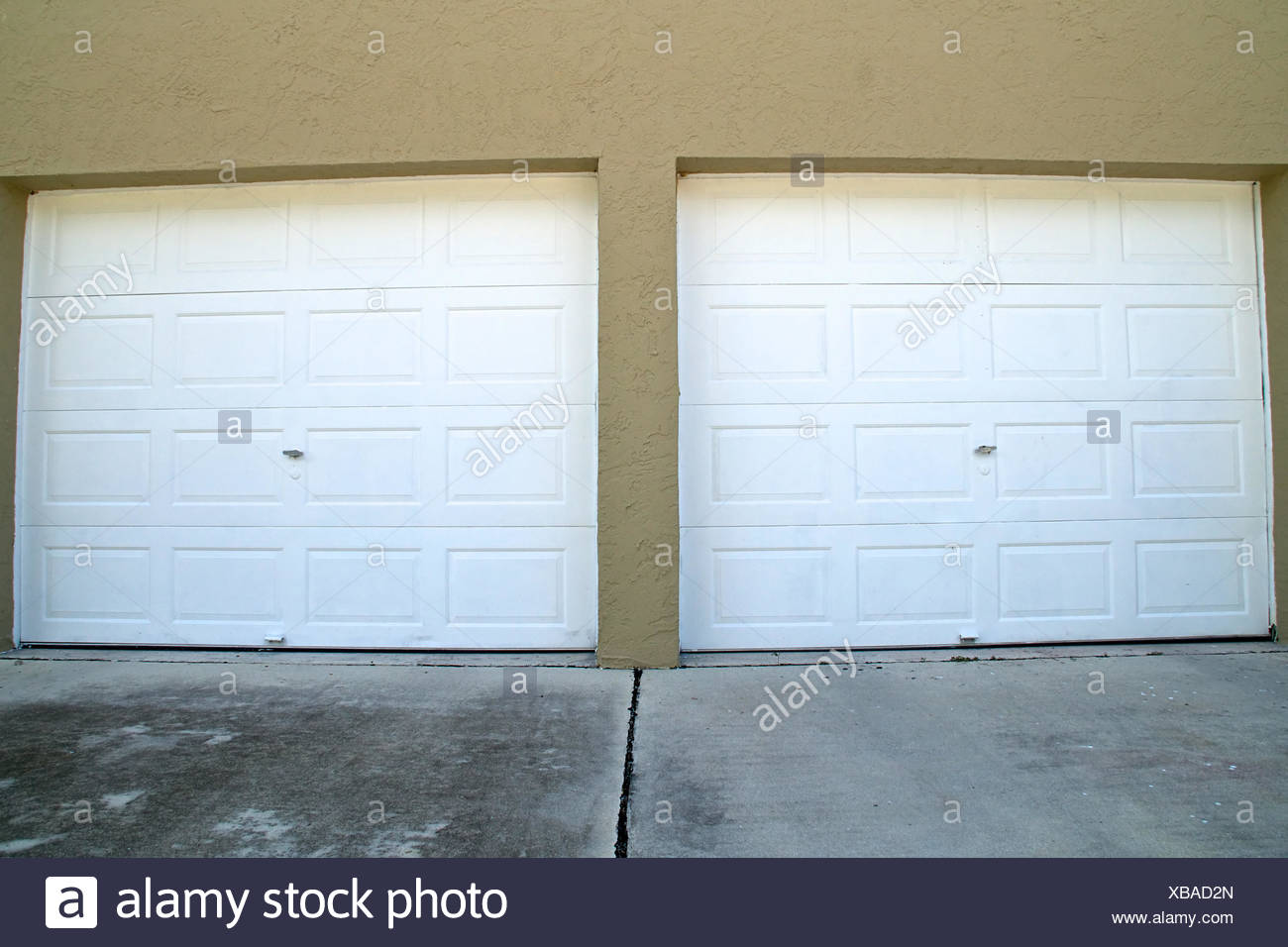 Wide Angle View Of Two White Closed Garage Doors At Top Of