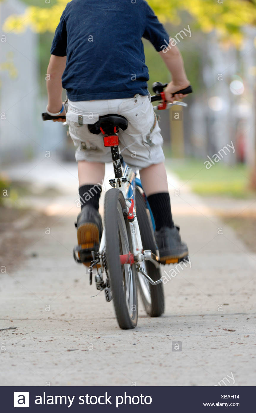 riding bicycle on sidewalk