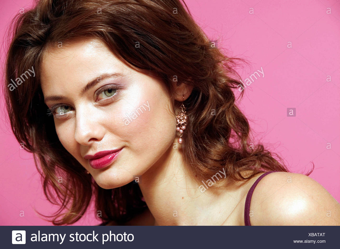 Female Curly Brunette Hair Purple Eyeshadow And Dark Red Lip