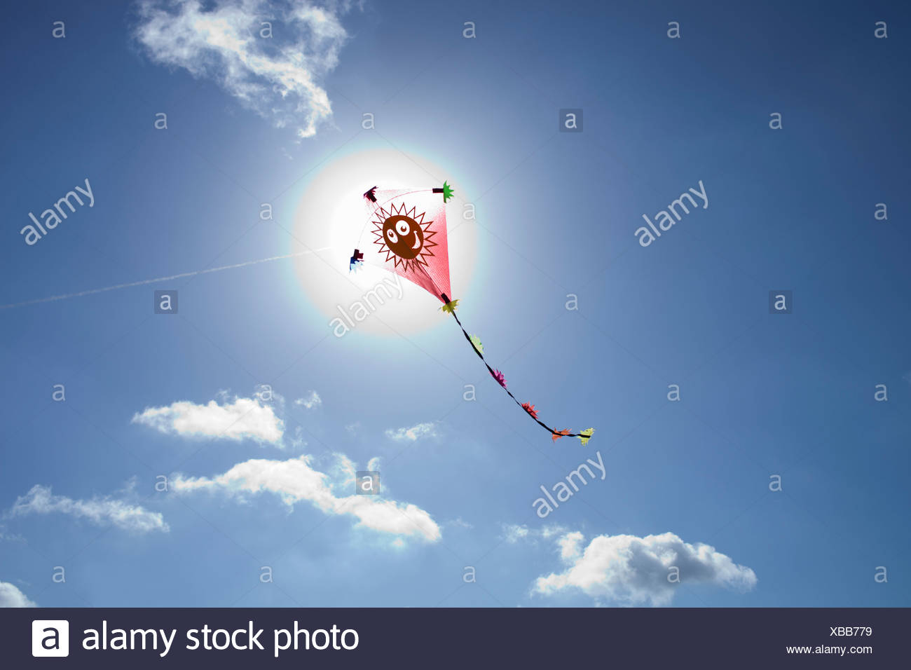 Kite in front of the sun Stock Photo