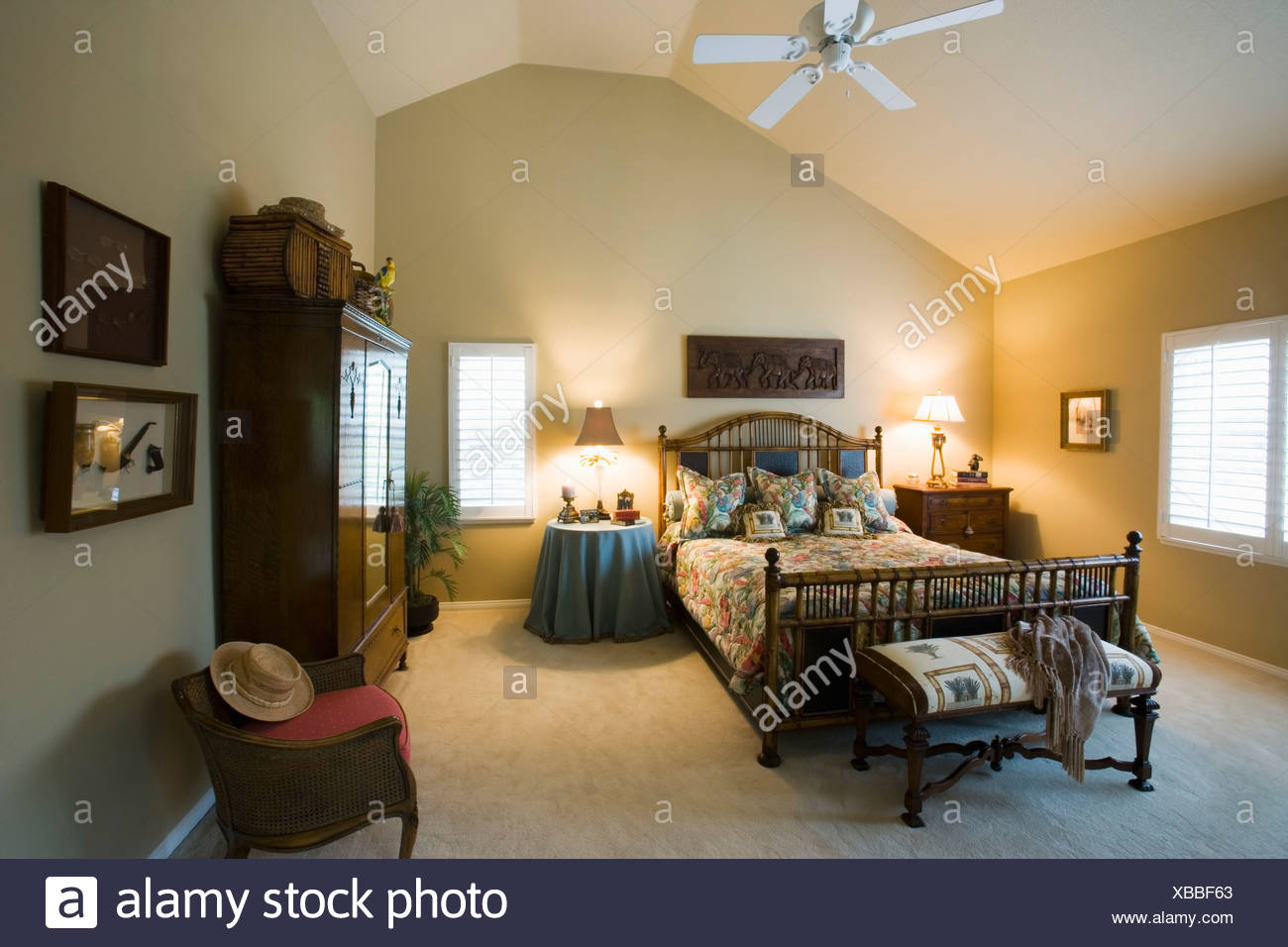 Beach Style Guest Bedroom With Vaulted Ceilings Stock Photo