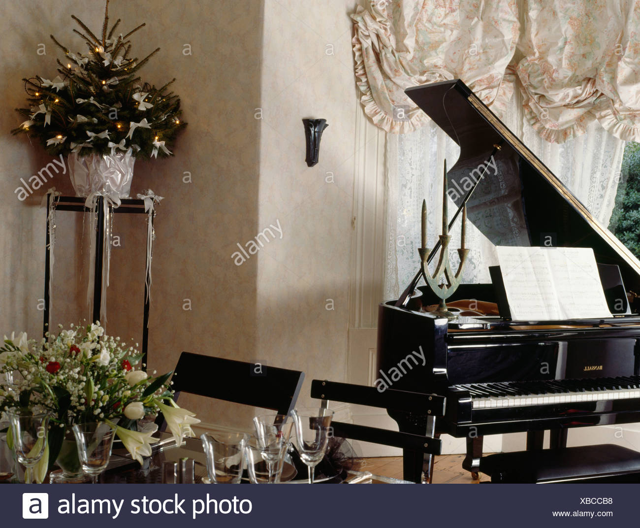 Piano And Small Christmas Tree On Pedestal In Corner Of Eighties