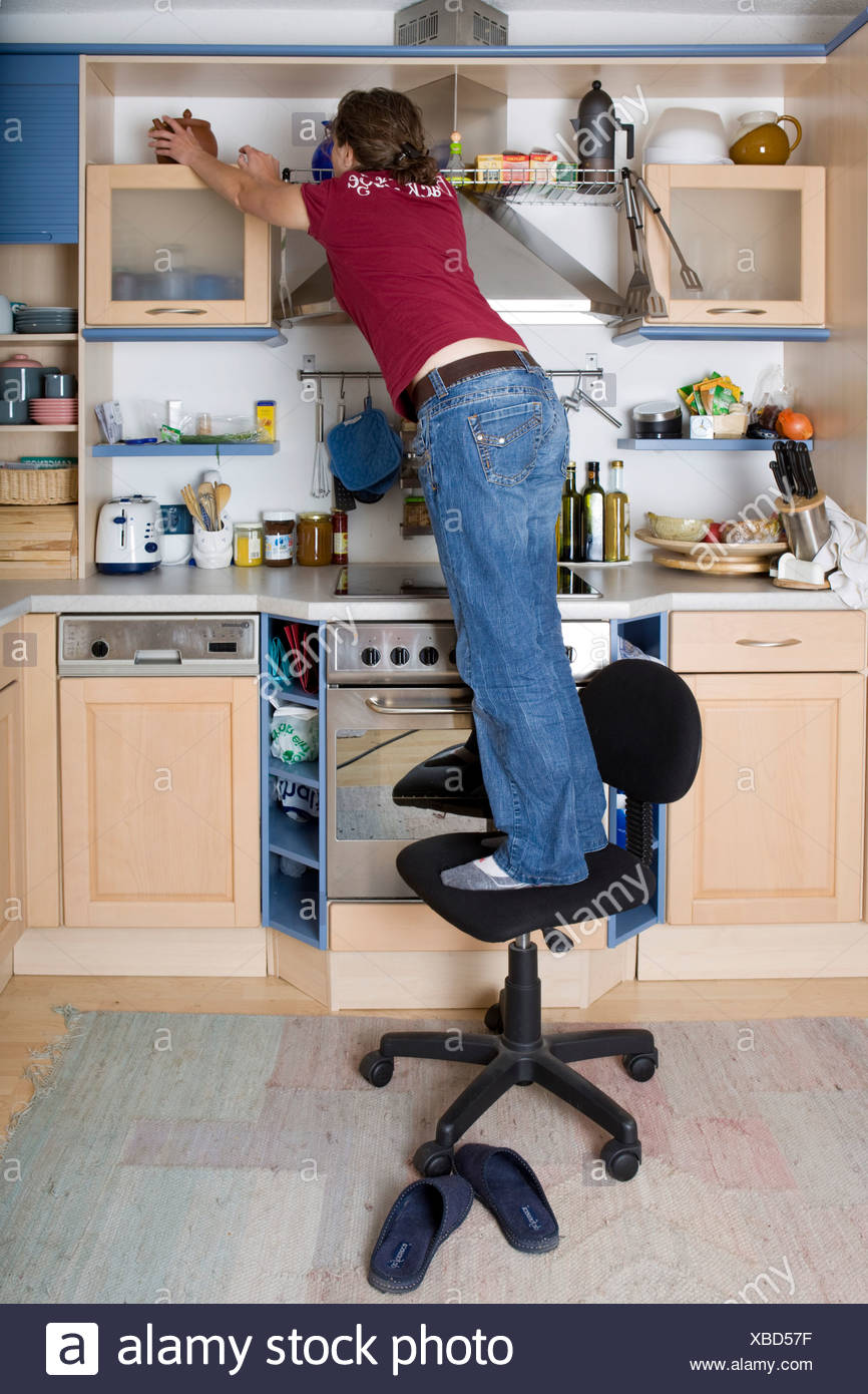 Standing On A Chair Dangerous High Resolution Stock Photography and